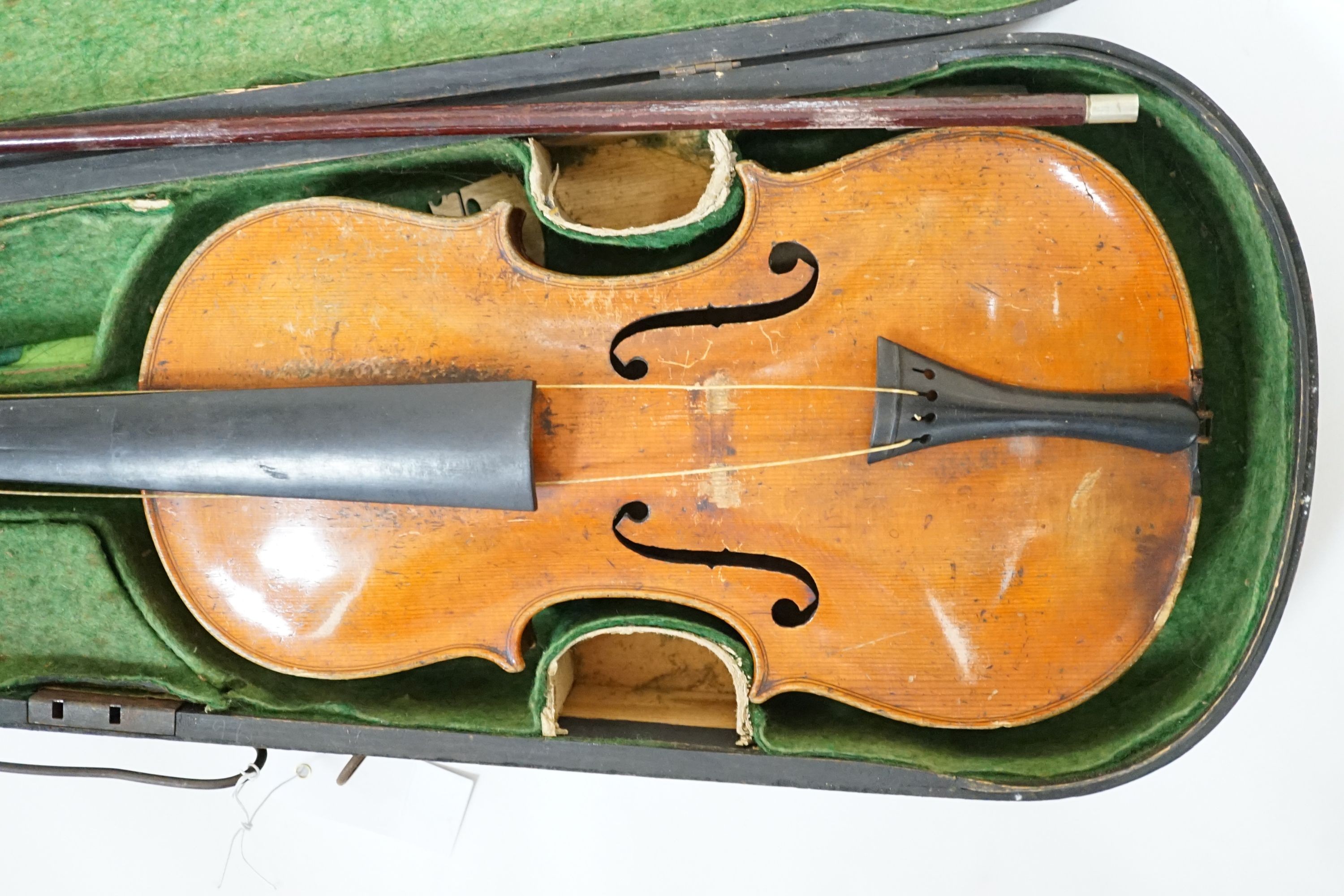 A 19th century 3/4 size violin, cased with 2 bows and 1 other German violin